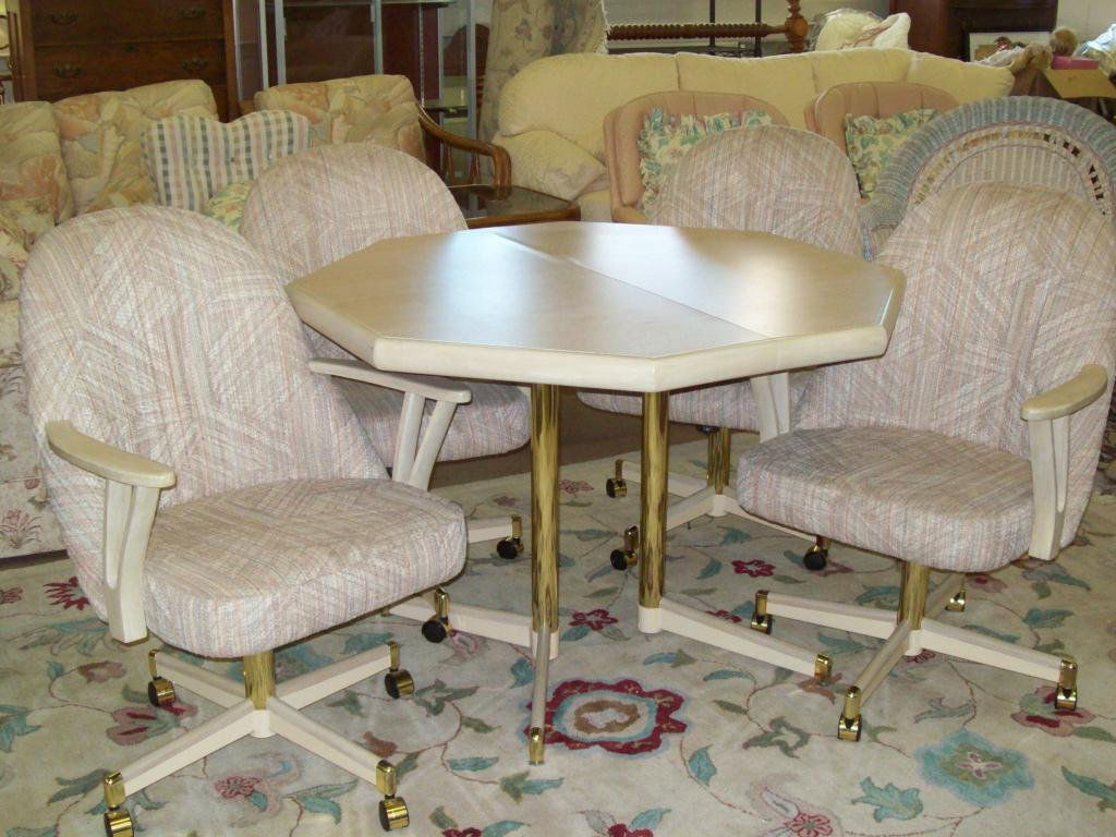 MIDCENTURY MODERN CHROMCRAFT TABLE & CHAIRS: Midcentury Modern Chromcraft octagonal table & swivel arm chair set Multicolor padded polyester brass & chrome design. Condition: Excellent. We do not ship furniture.