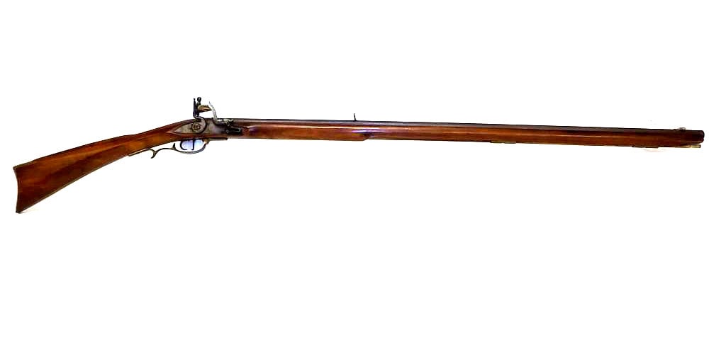 PEDERSOLI 36 CALIBER BLACK POWDER FLINT LOCK RIFLE: Pedersoli Italy .36 Caliber Black Powder Flint Lock Rifle.Serial No. 73948. Octagonal Barrel. Brass Hardware and Ram Rod.. Total Length 55" Working Order. Ref 4 Small chip upper end. NICS Check Requir
