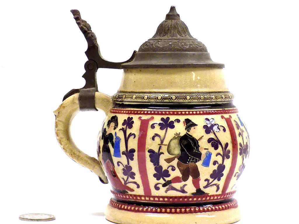 RENAISSANCE FIGURES GERMAN BEER STEIN: Antique German Pottery Beer Stein Depicting Surrounding Renaissance Figures and Foilage in Polychrome Relief. 1/4 Liter. Fancy Pewter Lid. Numbered 1283 Initial Z. Height 5.50"