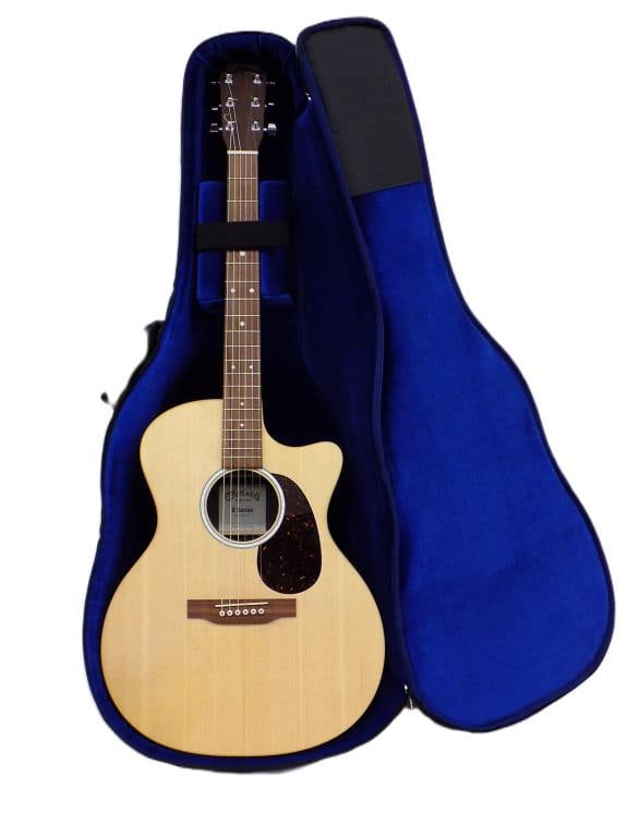 C.F. MARTIN & CO X SERIES ACOUSTIC ELECTRIC GUITAR: C.F. Martin & Company X Series Acoustic Electric Guitar. Right Handed 6 String. with Canvas Carrying Case with Blue Fleece Fitted Interior. The Martin X Series Special acoustic-electric guitar gives y
