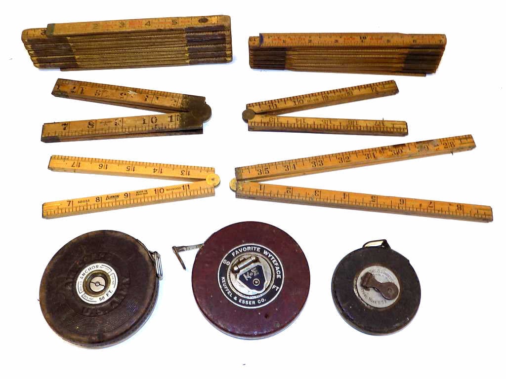 ANTIQUE RULERS MEASURING STICKS LOT: Group of Antique Folding Rulers / Measuring Sticks, Tape Measures. Includes Stanley No 68, Lufkin Made in England, U.S.A. Box Wood, Stanley 66 1/2, Lufkin Extension Ruler, Master Blue Tip, Keuffel & E