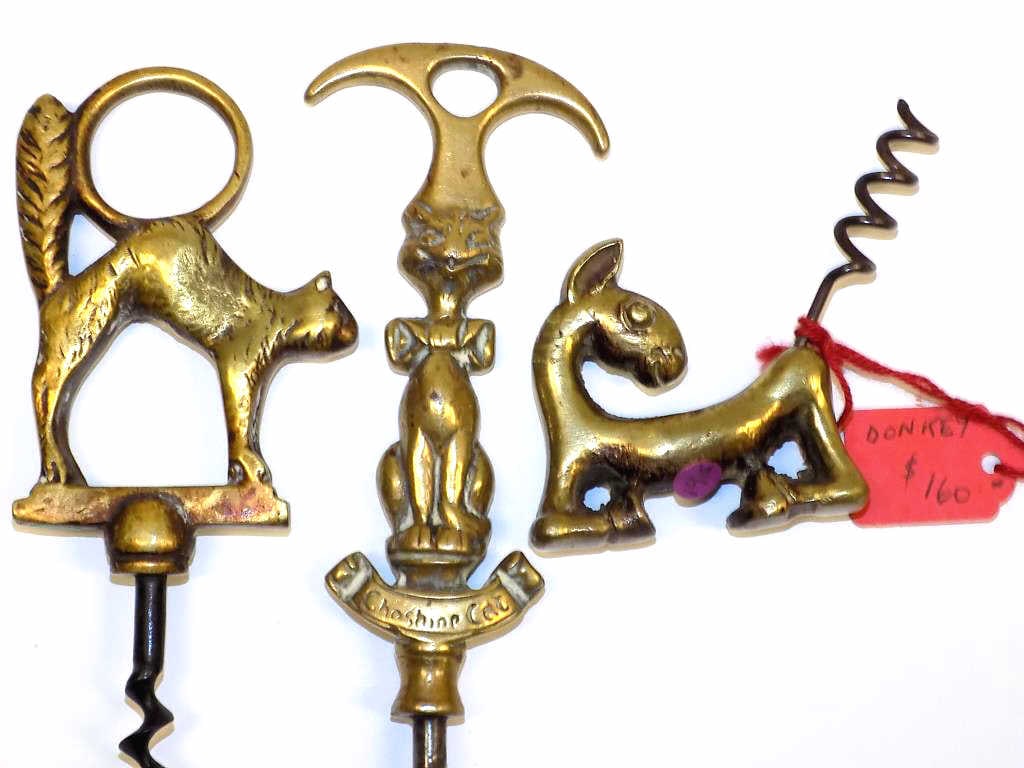RARE BRASS CAT AND DONKEY FORM CORKSCREWS: Rare Antique Brass Corkscrews. Including Cat with Tail Finger Ring, Cheshire Cat with Twist Handle, Donkey. All Circa 1920's 30's. Longest Length 6"