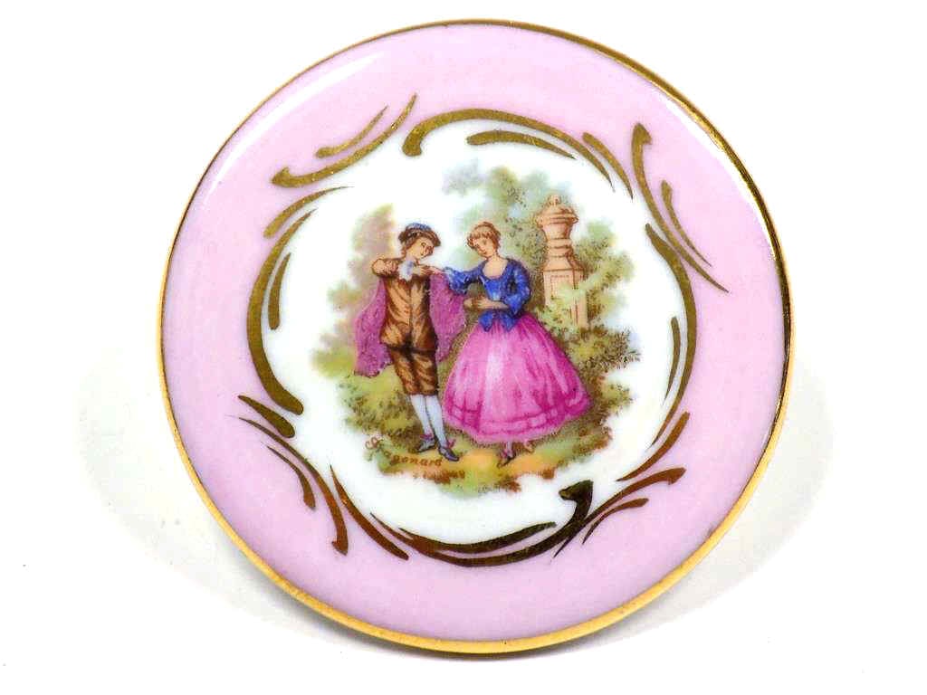 LIMOGES FRANCE GILT PORCELAIN BROOCH: Antique Limoges France Gilt Porcelain Brooch. Courting Scene. Signed Limoges France, Rehausst Main Gold Ink. Diameter 2.50"