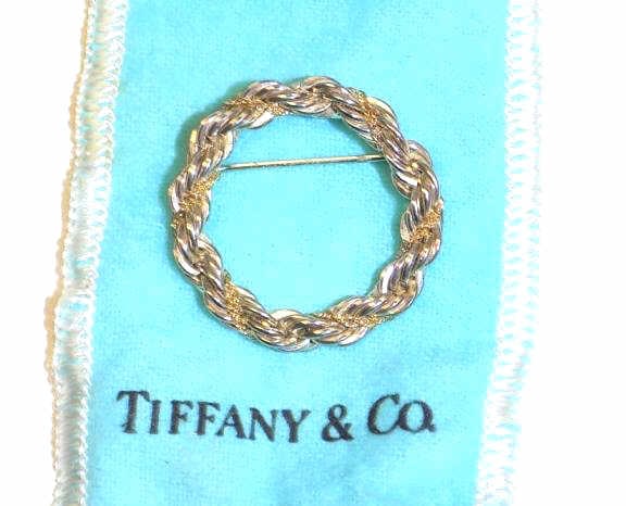 TIFFANY 18K YELLOW GOLD & STERLING WREATH BROOCH: Tiffany & Co. Sterling Silver Braided Wreath Brooch Pin with entwined 18K Yellow Gold Link Chain. Signed & Numbered with Original Pouch.