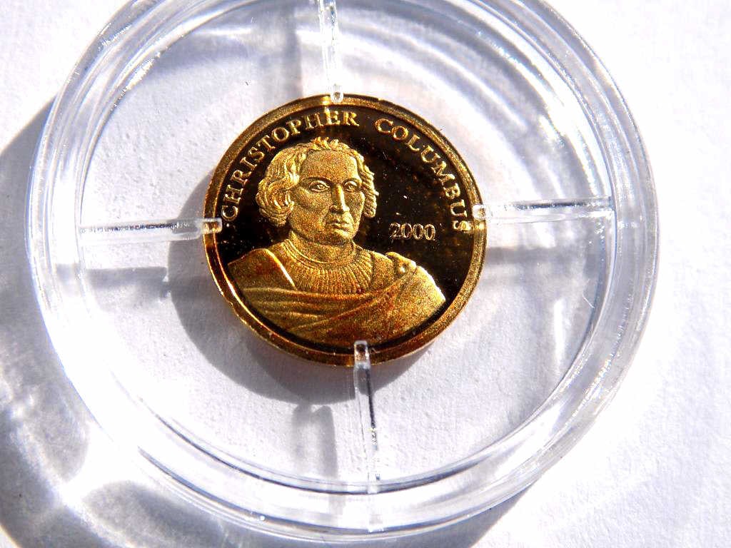 AMERICAN MINT CHRISTOPHER COLUMBUS 585 SOLID GOLD COIN: American Mint Christopher Columbus Proof Quality 585 14K Solid Gold Coin. Coat of Arms Reverse. 11 mm. Certificate of Authenticity.