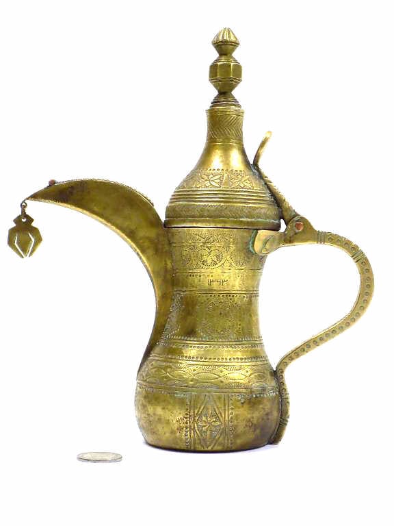 IMPORTANT ARABIAN GOLDEN DALLAH SIGNED COFFEE POT: Fine Arabian Golden Brass Dallah Coffee Pot. Extraordinary Hammering and Engraving Throughout, Hand Made. Signed and Dated Amal Qasim. Height 9.50" x Width 8". Provenance: From The Private Estate of a