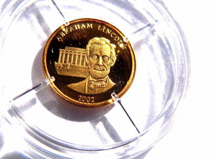 AMERICAN MINT ABRAHAM LINCOLN 585 GOLD COIN: American Mint Abraham Lincoln Proof Quality 585 Solid Gold Coin. Coat of Arms Reverse. 11 mm. Certificate of Authenticity.