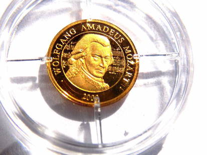 AMERICAN MINT WOLFGANG A. MOZART 585 GOLD COIN: American Mint Wolfgang Amadeus Mozar Proof Quality 585 Solid Gold Coin. Coat of Arms Reverse. 11 mm. Certificate of Authenticity.