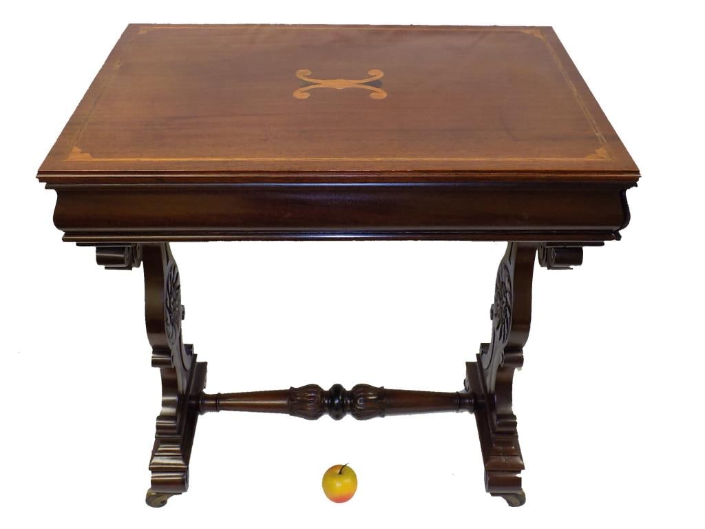 REGENCY INLAID MAHOGANY CONSOLE TABLE: Exceptional 19th Century Regency Period Mahogany Console Table. Fine Fruitwood Inlay. Elaborately Scroll Carved Sides with Rosette Medallion Centers. Connected with Bellflower Carved Stretcher. Secret