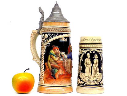 ANTIQUE GERMAN DRINKERS BEER STEIN W/ BONUS: Antique German 1 Liter Beer Stein Tankard. Multi Color Pottery Relief Depicting 2 Drinkers. Along with an Amsterdam Holland Scene Stein with Windmill, Lovers and Sailboat Vignettes. Height 11" and 7"