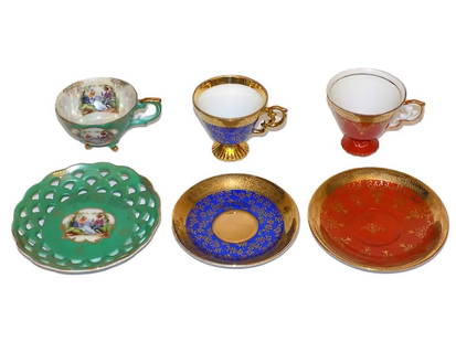 FANCY DEMITASSE TEA CUP & SAUCER GROUP: Fancy Group of Antique Demitasse Porcelain Tea Cup & Saucer Sets. Victorian Courting Scene with Reticulated Border, Royal Blue & Coral with Gold Gilt Decoration. Largest Saucer Diameter 5"