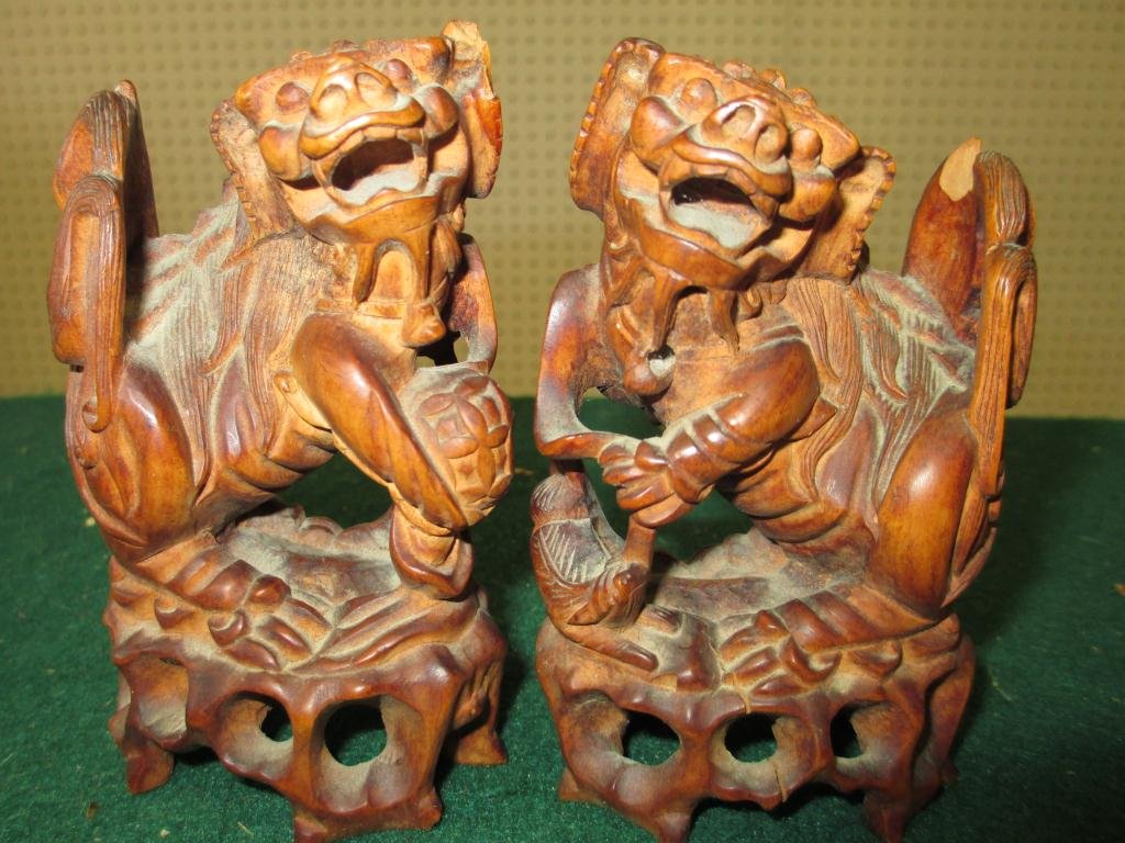 PAIR MINIATURE CHINESE ROOT WOOD FOO DOGS: Vintage pair miniature carved rootwood Chinese foo dogs. H 4" . Condition: patinized, minor chip