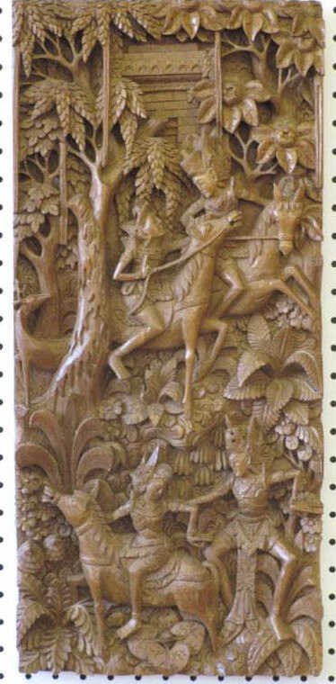 ANTIQUE INDONESIAN CARVED WOOD PLAQUE: Antique ornate hand carved Indonesian wood wall plaque. Couples on horseback surrounded by flowers & trees. H 24" x L 11" x W 1.50"