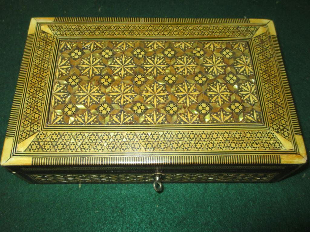 DAMASCENE INLAID LIDDED LOCK BOX: 19th Century tunbridge inlaid lidded exotic wood lock box . Sunbursts , rosettes bone & abalone inlay . Original Key. H 3" x L 10.25" x W 6.50"