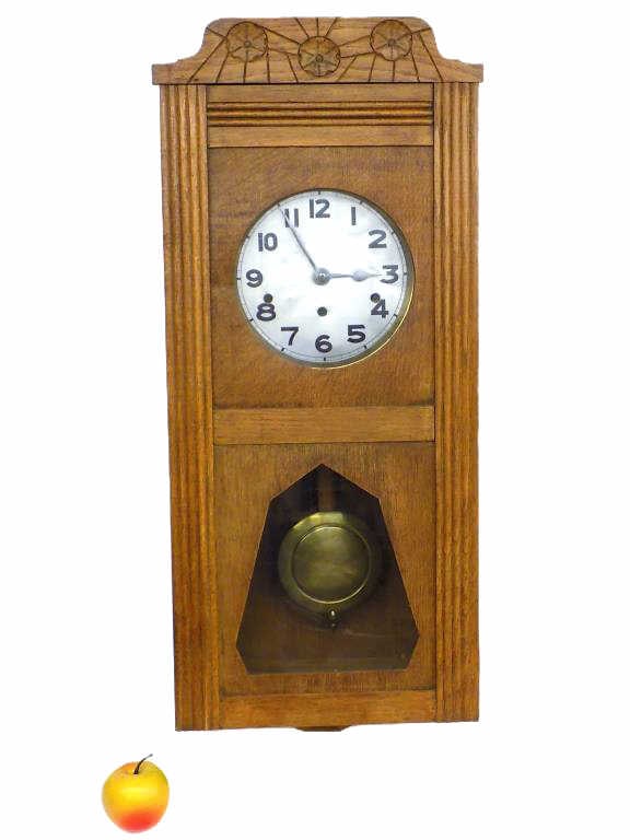 ARTS & CRAFTS WESTMINSTER OAK WALL CLOCK: Antique Arts & Crafts Oak Wall Clock. German Movement By Kienzie. Carved Rosette Crest. Original Pendulum & Key. Height 28" x Width 6" x Length 13" 16 lbs Working order