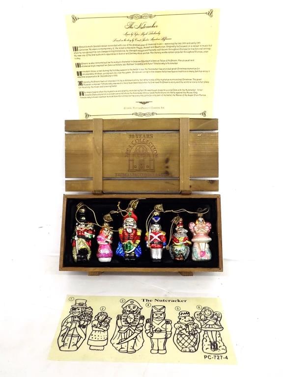 THOMAS PACCONI NUTCRACKER CHRISTMAS ORNAMENTS: Thomas Pacconi 2004 Collection 30 Years Classics Nutcracker Set of 6 Hand Blown Christmas Ornaments. In Wooden Storage Crate with Diagram and Certificate of Authenticity. 2.50" x 5" x 9.50" 1 lb