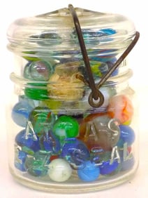 ANTIQUE ATLAS MASON JAR WITH 85 MARBLES