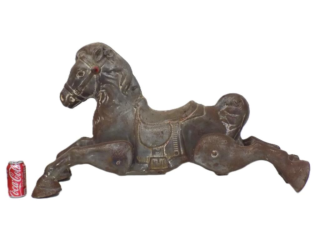 BIG VINTAGE 1950'S RUSTIC CAROUSEL HORSE TOY: Big 1950's Made in England Carousel Horse Toy. Embossed Metal with Old White Paint Remnants. 22.50" x 12" x 37" 11 lbs
