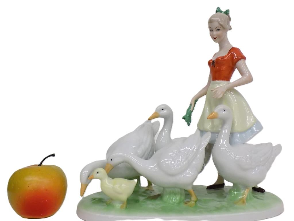 BIG RPM GERMANY GIRL WITH GEESE PORCELAIN GROUP: Big R.P.M. Company Girl With Geese Porcelain Figurine Group. Painted and Glazed. Made in Germany. 7048 with Base Mark. Height 11" x 5.50" x 11" 3 lbs