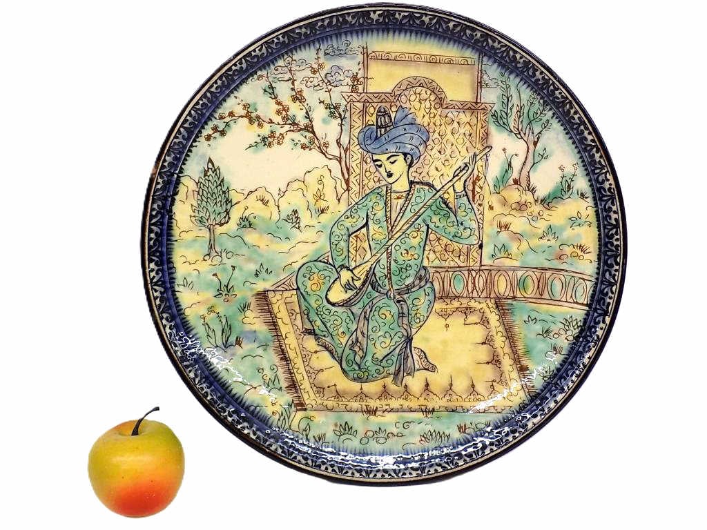PERSIAN QATAR NOBLE GLAZED POTTERY CHARGER: Antique Persian Qatar Glazed Pottery Charger. Depicting a Noble Playing Musical Instrument in a Nature Setting. Measures 1.50" x 13.50" x 13.50" 3 lbs