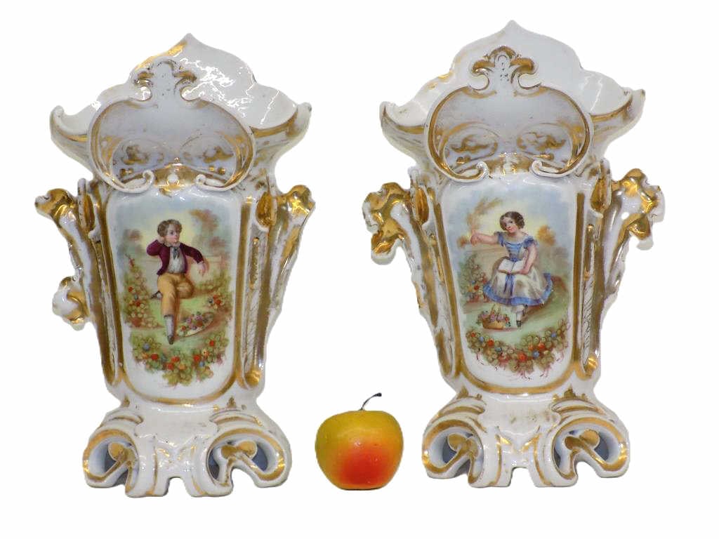 MONUMENTAL OLD PARIS VASES CHARMING CHILDREN 14": 19th Century Monumental Pair of Old Paris Porcelain Vases. Fancy Scrolled Design with Gold Gilt Accents. Depicting a Charming Boy and Girl in Nature Settings. Height 14" x 7" x 8" 11 lbs Some ear loss
