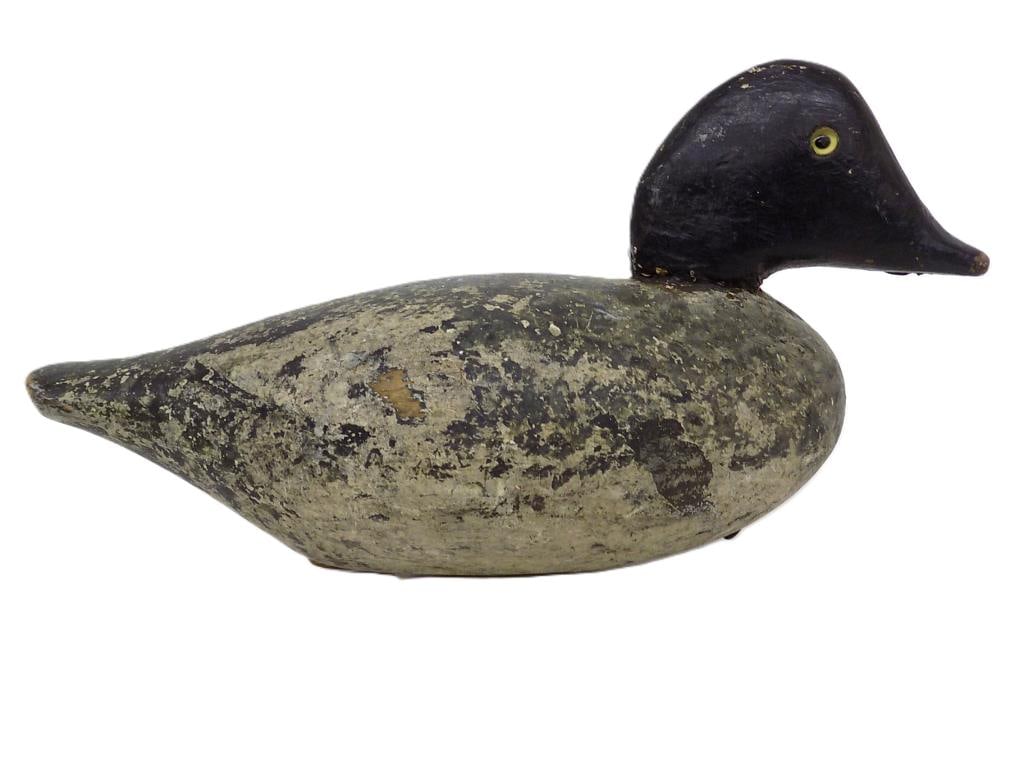 PRIMITIVE FOLK ART WOODEN DUCK DECOY: Primitive Folk Art Wooden Duck Decoy. Hand Carved and Painted. Glass Eyes and Lead Base Weight. Height 6.50" x 5.25" x 13.25" 2 lbs. Base Initialed R.K. Great Patina