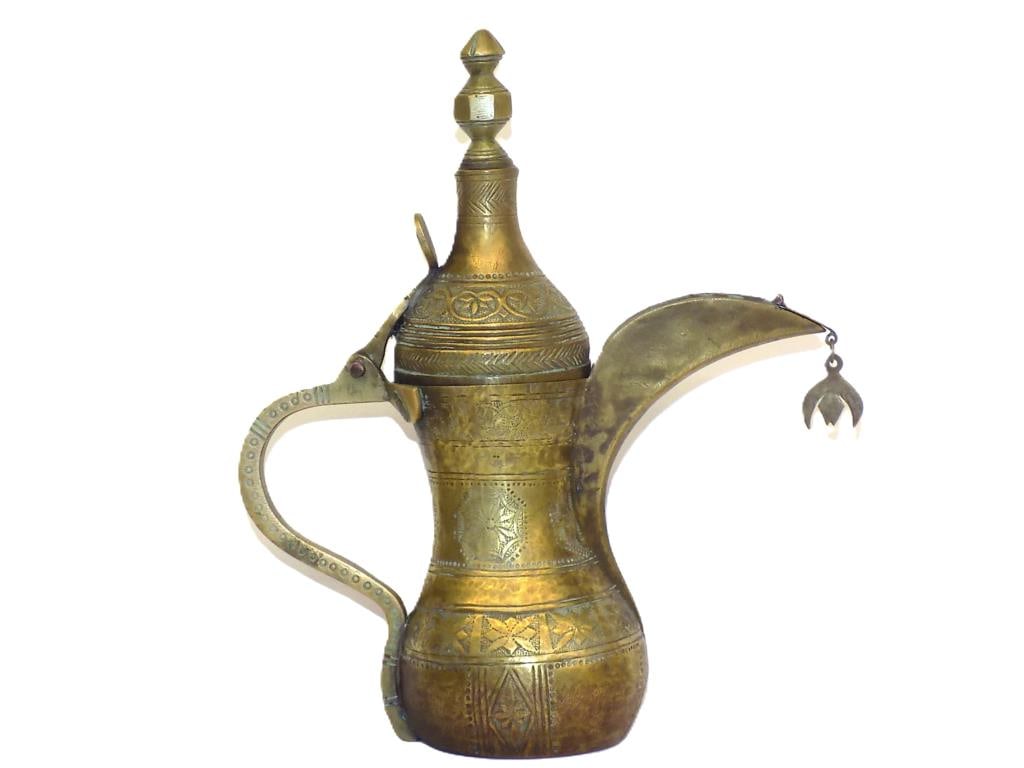 IMPORTANT ARABIAN GOLDEN DALLAH SIGNED COFFEE POT: Fine Arabian Golden Brass Dallah Coffee Pot. Extraordinary Hammering and Engraving Throughout, Hand Made. Signed and Dated in Islamic writing 9.50" x 3 x 8" 1 lb Provenance: From The Private Estate of