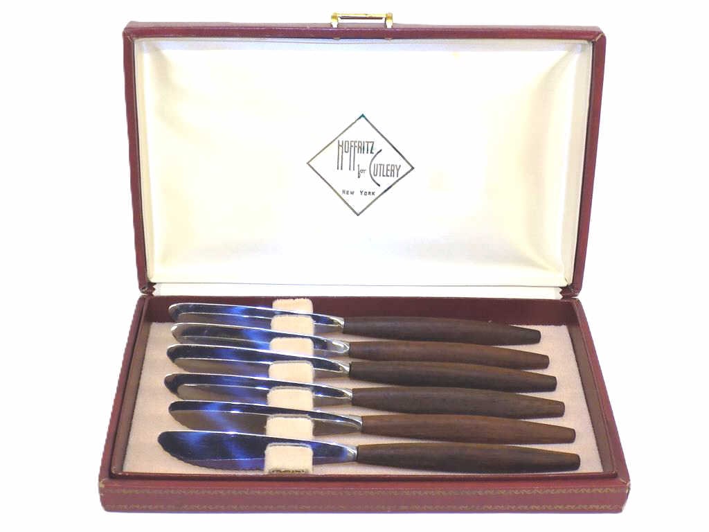 MIDCENTURY MODERN HOFFRITZ DANISH TEAK KNIFE SET: Midcentury Modern Hoffritz Cutlery New York Danish Teak Knife Set With Original Box. Stainless Steel Signed Blades. Box Height 1" x Width 6" x Length 10.25" 1 lb