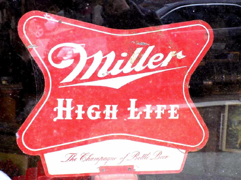 MILLER HIGH LIFE BEER STREET ADVERTISING SIGN: Vintage Miller High Life the Champagne of Beers Advertising Street Sign. Double Sided Steel mounted on Original Red painted Iron Pole Height 48". Sign 11 1/2" x 14"