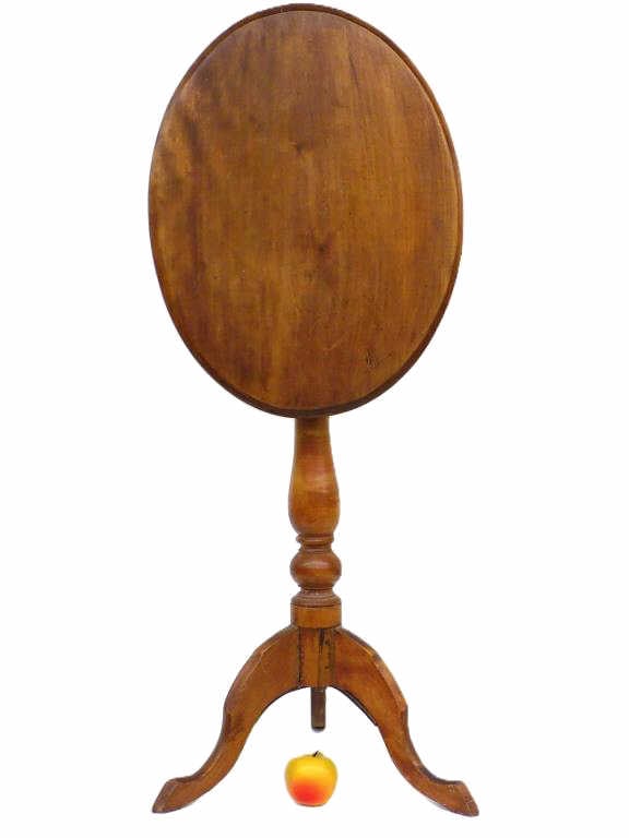 19TH CENTURY HUDSON VALLEY TILT TOP CANDLE STAND: 19th Century Hudson Valley Cherry Tilt Top Candle Stand. Turned Bulbous Column with Tri Foot Base. Total Height 39" Top Down 26.50", Top 15" x 20" Provenance: From a Prominent Hudson Valley Estate