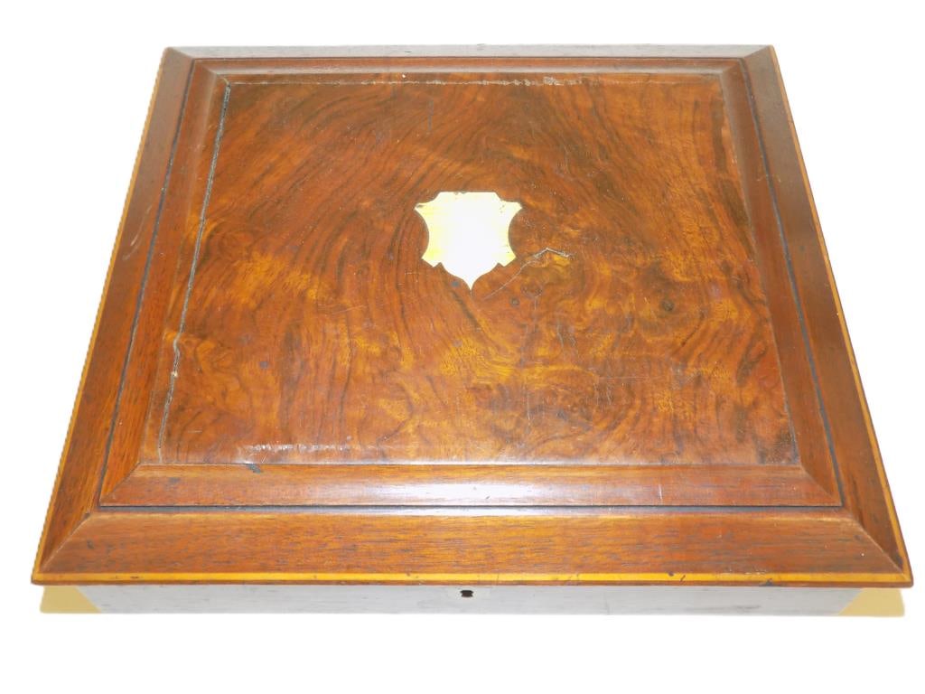 EDWARDIAN MAHOGANY CUTLERY BOX SET: 19th Century Edwardian Cutlery Box. Fine Mahogany with Fruitwood Banding. Inset Brass Shield Form Cartouche and Escutcheon. Blue Ruffled Silk Fitted Interior. Contains Varous Sets of Antique Silverpla