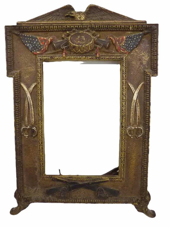 ANTIQUE PATRIOTIC AMERICAN EAGLE CAST IRON FRAME: Antique HL Judd Mfg Co. Circa 1915 World War I Patriotic American Eagle Cold Painted Cast Iron Picture Frame. Rear Swing out Leg. Also Features Draped American Flags, War Drum, Bugles, Artillery Sword