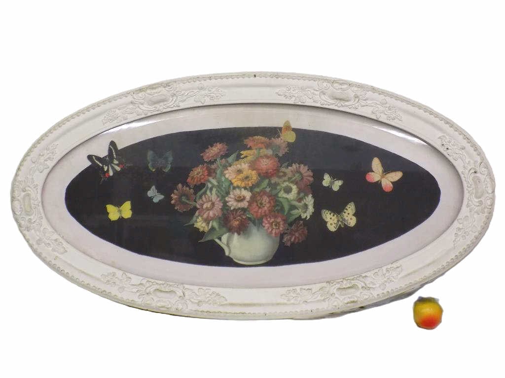 BIG VICTORIAN FRAMED FLOWER BUTTERFLY PRINT 45": Big Victorian Oval Framed Picture. Fancy Floral Scrolled Borders. Depicts Vased Flowers and Flying Butterfly Cut outs. Measures 45" x 1" x 23" 20 lbs We can refer a shipper on this item