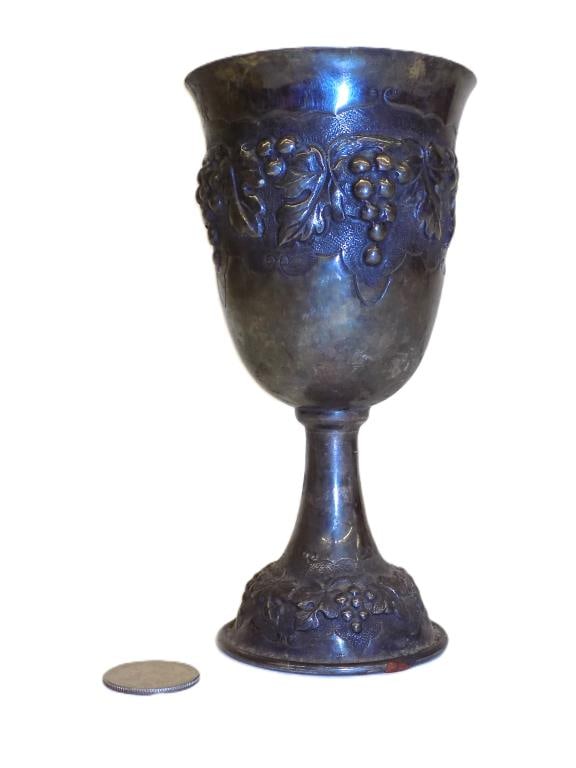 ELABORATE STERLING SILVER WINE GOBLET: Antique Sterling Silver Wine Goblet. Decorated With Surrounding Repousse Grapevines. Judaic Maker Mark and 925 Purity Mark. Height 6.25" x 3.25" x 3.25" 5.86 Troy Oz