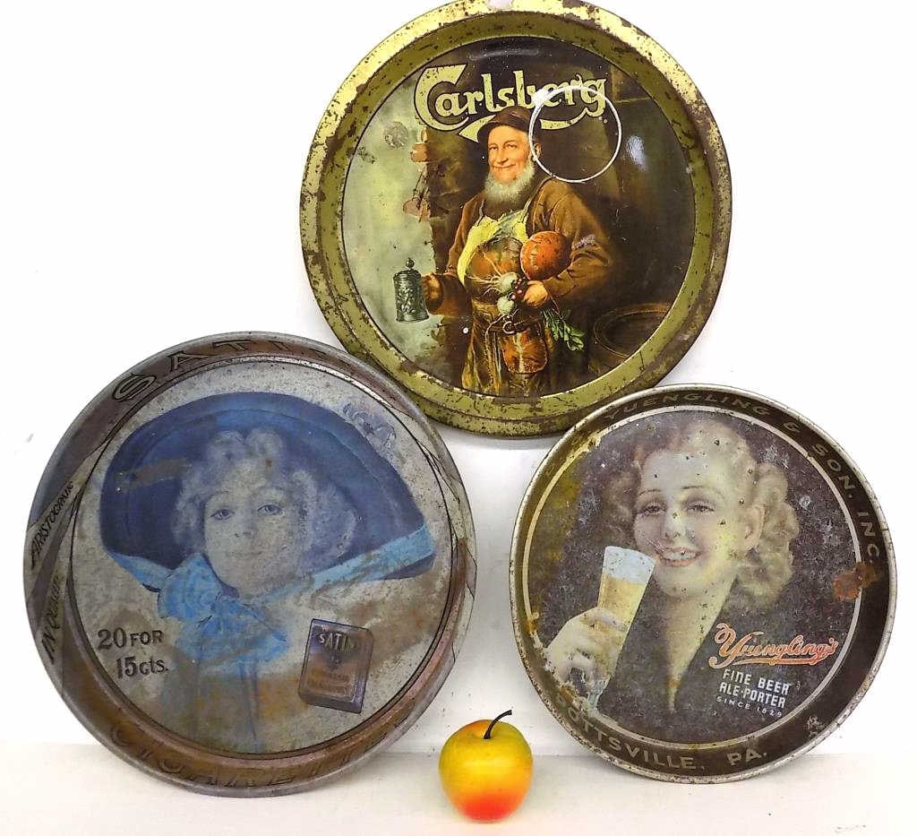 SATIN CIGARETTES YUENGLING CARLSBERG BEER TRAYS: Vintage Advertising Metal Beer Trays Lot. Including Satin Cigarettes, D.G. Yuengling and Carlsberg Beer. First Two with Pretty Girls. Combined Measurement 14" x 1.50" x 14" 2 lbs