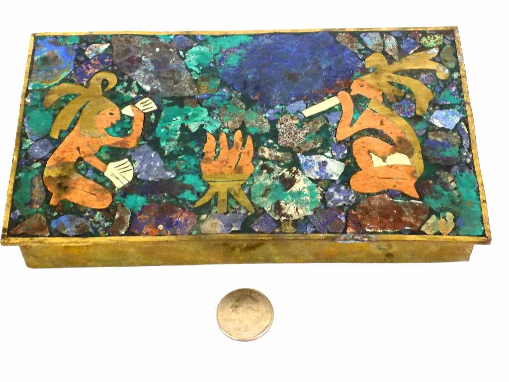 VINTAGE INDIANS FOLK ART MIXED METAL CIGARETTE BOX: Vintage 1950's Mexican Crafted Mixed Metal Cigarette Box. Artisan Crafted with Inset Brass, Copper, Silver and Multi Color Enamel. Tribal Scene with Indians by a Fire pit. Approximately 1.25" x 4.50" 