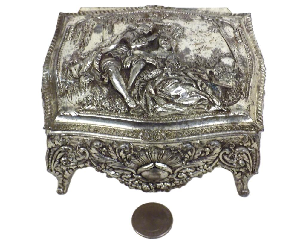 VICTORIAN COURTING SCENE SILVER PLATE JEWELRY BOX: Vintage Victorian Courting Scene Silverplate Jewelry Box. Red Velvet Interior. Detailed Scrolled Acanthus and Floral Drapery Design. 2.50" x 4" x 5" 1 lb Small piece of hinge bracket absent