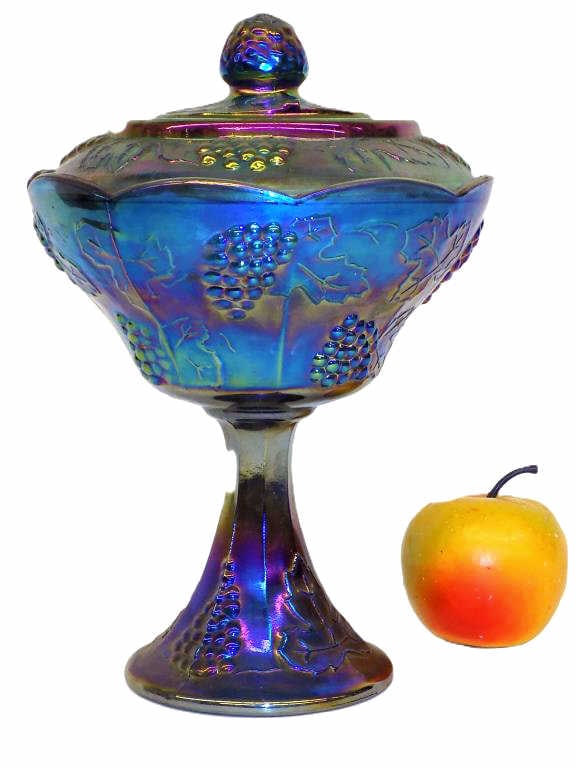 IRIDESCENT BLUE GRAPES CARNIVAL GLASS CANDY JAR: Antique Iridescent Blue Green Purple Carnival Glass Covered Candy Jar. Surrounding Grapes, Vines, Leaf Decoration. Height 10" x 7" x 7" 3 lbs