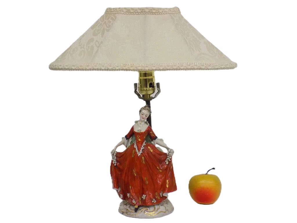 VICTORIAN MAIDEN PORCELAIN FIGURINE LAMP: Meissen Style Beautiful Victorian Maiden In Fancy Dress Holding Flowers. German Porcelain with Gold Gilt Accents. Base Mark. Figure Height 8.25" Working Order.