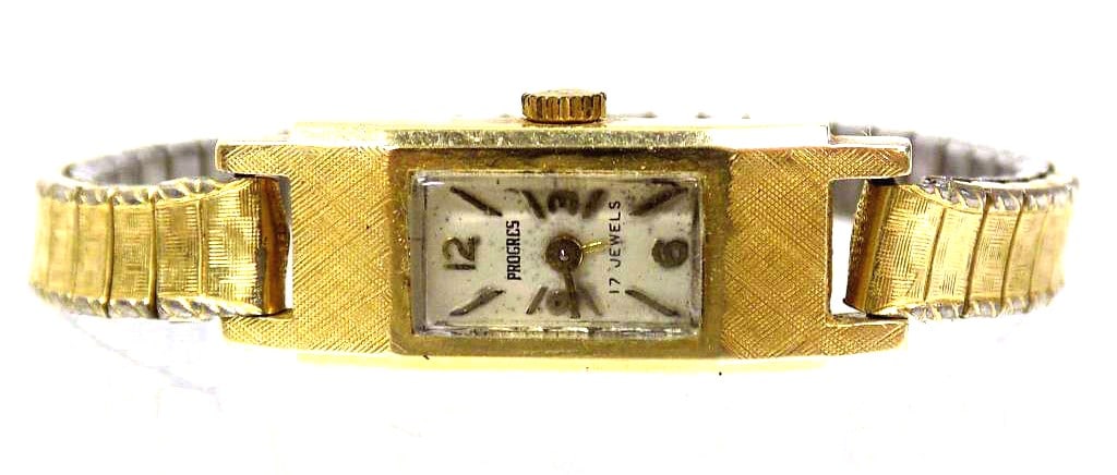 14K GOLD PROGRES LADIES WRISTWATCH 16.7 GRAMS: Vintage Solid 14K Yellow Gold Progres Ladies Wristwatch. 17 Jewels. Spiedel band gold filled. Working Order. 16.7 grams tw