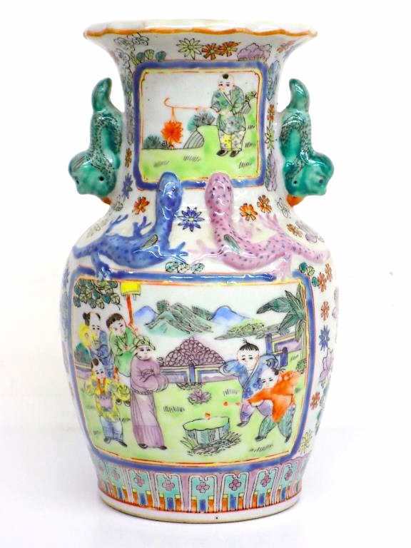 CHINESE FAMILLE VERTE PORCELAIN DRAGONS VASE: Chinese Famille Verte Porcelain Vase. Surrounding Painted Panels Depicting Outdoor Scenes with Figures. Symbolic Dragons and Foo Dogs. Chinese Reign Seal on Base. Height 9.25" x Width 5" x Length 5" 3