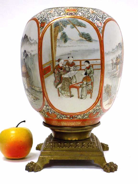 19TH CENTURY JAPANESE IMARI VASE W/ BRONZE BASE: 19th Century Japanese Imari Porcelain Vase with Bronze Clawfoot Base. Hexigonal Panels Depicting Figures and Outdoor Scenes. Hand Painted with Gold Gilt Accents. Height 11.25"