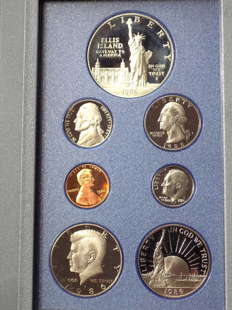 US MINT 1986 PRESTIGE PROOF COIN SET: United States San Francisco Mint 1986 Prestige Proof Coin Set. Containing Statue of Liberty Ellis Island Silver Dollar $1, Liberty In God We Trust Half Dollar, JFK Kennedy Half Dollar, Washington Quar