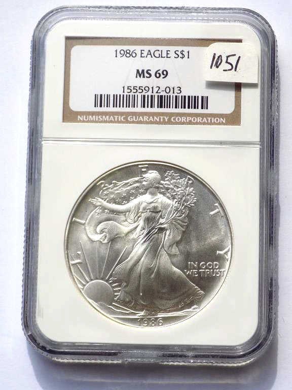 US MINT 1986 SILVER EAGLE DOLLAR NGC MS 69: United States Mint 1986 Silver Eagle $1 Dollar Coin. Walking Liberty Obverse, Heraldic Eagle Reverse. 1 Oz Fine Silver. NGC Sealed & Graded MS 69