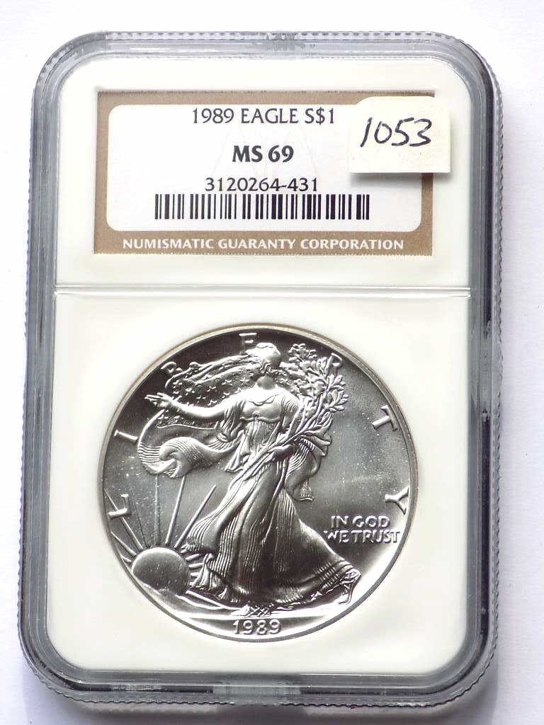 US MINT 1989 SILVER EAGLE DOLLAR NGC MS 69: United States Mint 1989 Silver Eagle $1 Dollar Coin. Walking Liberty Obverse, Heraldic Eagle Reverse. 1 Oz Fine Silver. NGC Sealed & Graded MS 69