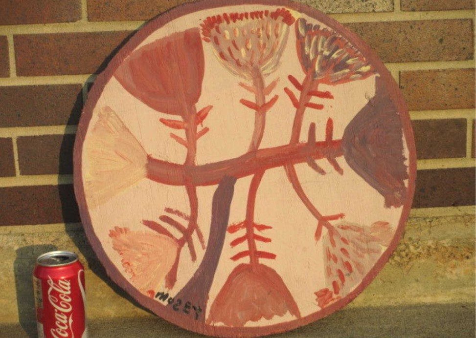 MOSE T TOLLIVER FOLK ART FLOWERS PAINTING: Mose Tolliver American 1920-2006 - Southern Alabama Circa 1980 Folk art painting on round artist hand cut plywood . Acrylic house paint . Tulips & flowers signed lower left . H 18" x L 18" . Provenanc