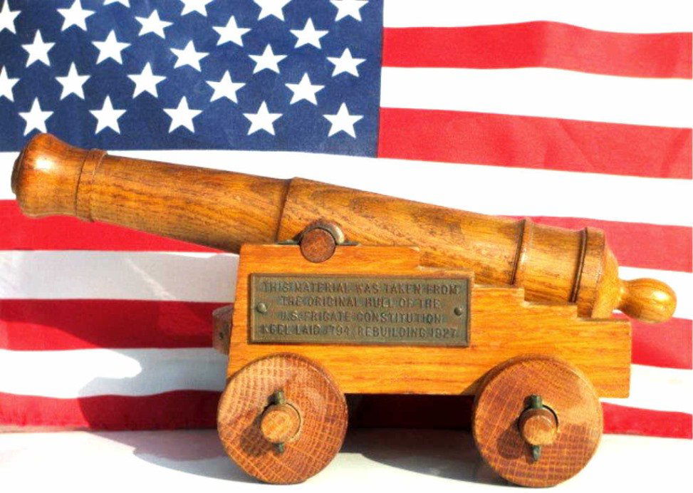 RARE U.S. CONSTITUTION HULL CARVED CANNON: U.S. United States Constitution hand carved folk art oak rolling cannon . Made from the original hull off the Famous American Battleship. Bronze plaque reads: This material was taken from the original