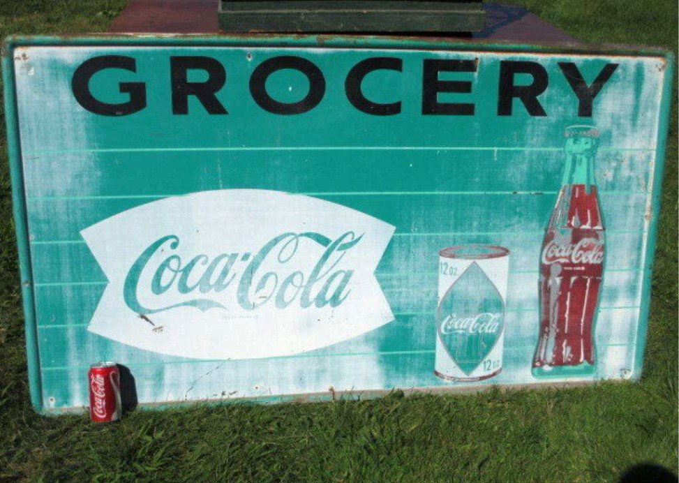 COCA COLA COKE GREEN GROCERY SIGN: Antique steel country grocery store Coca Cola / Coke advertising sign . Vintage green , white & black paint. Advertising a can & tall bottle of Coke. H 31.50" x L 55". Condition: call for condition re