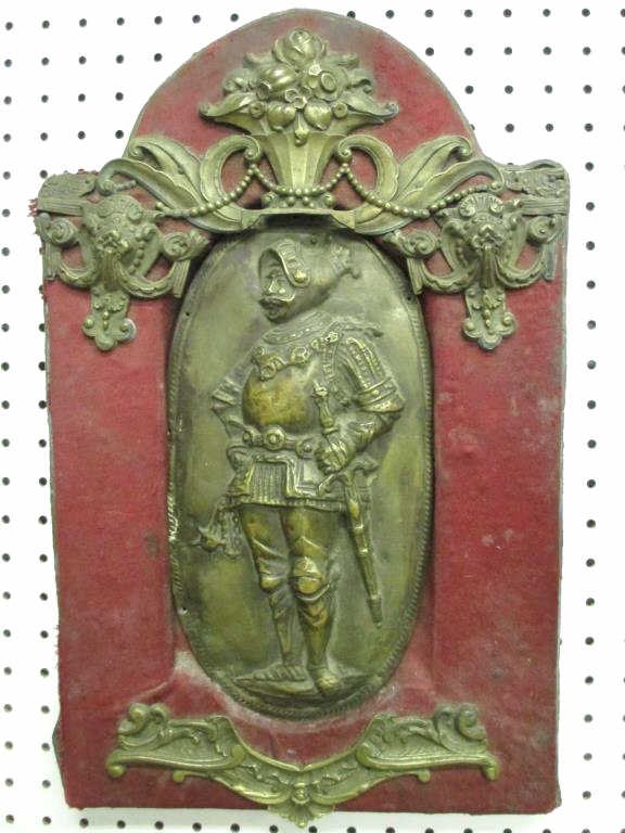 19TH CENTURY BRONZE KNIGHT PLAQUE: 19th Century bronze knight plaque. Solid bronze ormolu mounts with heavy sheeted center plaque (probably lead filled). Drapery with scrollwork & Floral basket crest. H 19.50" x L 12.50".