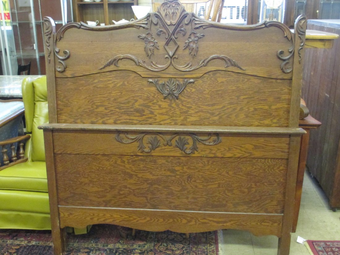 ANTIQUE ART NOUVEAU OAK TWIN SIZE BED: Antique Art Nouveau oak twin size bed. Applied scrollwork & foilage. H 61" x W 57" x L 78". We do not ship furniture. Please pick up or contact an outside shipper.
